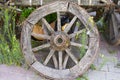 Old wheel is leaning against the old horse car Royalty Free Stock Photo