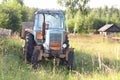 Old wheel tractor with the trailer