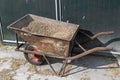 Old wheelbarrow with feed on a farm in the Netherlands Royalty Free Stock Photo