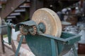 An old whetstone for sharpening knives. Grinding wheel on an old Royalty Free Stock Photo