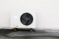 Old white air conditioner compressor. rust metal on floor Royalty Free Stock Photo