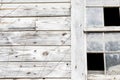 Old white barn with broken window Royalty Free Stock Photo