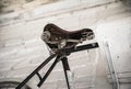 Old white bicycle whist on a white stone wall. Royalty Free Stock Photo