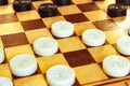 White and black checkers on the Board Royalty Free Stock Photo