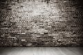 an old white brick wall and floor in the home interior as a background or texture Royalty Free Stock Photo