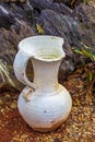 Old white broken pitcher Royalty Free Stock Photo