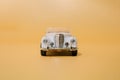 Old white cabriolet classic car. Oldtimer metal limousine toy. Front view. Minimal design. Copy space Royalty Free Stock Photo