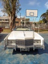 Old white 1976 Cadillac Eldorado convertible two door in a park.