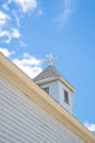 Old white church steeple and cross Royalty Free Stock Photo