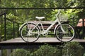 Old white classic vintage retro bicycle exterior decoration furniture of garden outdoor for travelers visit at Phu Foi Lom in Pa Royalty Free Stock Photo