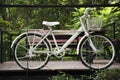 Old white classic vintage retro bicycle exterior decoration furniture of garden outdoor for travelers visit at Phu Foi Lom in Pa Royalty Free Stock Photo