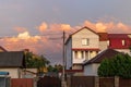 Old white cottage in cozy town. Street view landscape old cirty, little houses on sunset. Old architecture front view Royalty Free Stock Photo