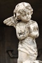 An Old White Crumbling Cherub Angel Statue Royalty Free Stock Photo