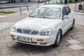 Old white Daewoo Leganza limousine sedan parked