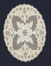 Old white doily with flowers