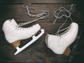 Old white female skates for figure skating with unbound laces Royalty Free Stock Photo