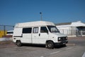 Old white Fiat Ducato van parked on the street.