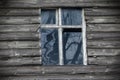 Old white frame wooden window with dirty broken glass Royalty Free Stock Photo