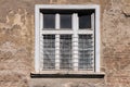 Old white framed window on an old, ruined building Royalty Free Stock Photo