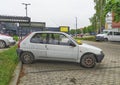 Old white small compact car Peugeot 106