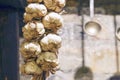 Old white garlic hung in an old kitchen.