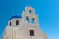 Old white greek church with blue dome on sky background on Santorini island. Greece Royalty Free Stock Photo
