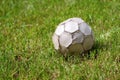 Old leather soccer ball on grass - Football Sport Royalty Free Stock Photo