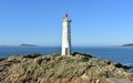 Old white lighthouse with blue sky at famous Rias Baixas Region. Muxia, Galicia, Spain. Royalty Free Stock Photo