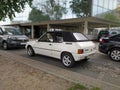 Old white little cabrio car Peugeot 205 convertible parked Royalty Free Stock Photo