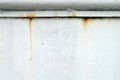 A old white metal wall with a minor rust periodic drip on the top for texture and background Royalty Free Stock Photo