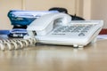 Old white office phone with cord Royalty Free Stock Photo