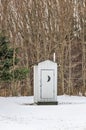 White Outhouse with a Crescent Moon Royalty Free Stock Photo