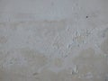 Old white paint texture peeling off concrete wall.Grunge Background Texture, Abstract Dirty Splash Painted Wall. Royalty Free Stock Photo