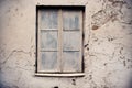 Old white painted window on aged white wall with cracks Royalty Free Stock Photo