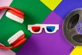 Old white paper 3d glasses with blue and red lenses and red headphones on vintage color background. Retro stereoscopic Royalty Free Stock Photo