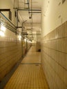 Old white paved depressive corridor Royalty Free Stock Photo