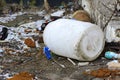 An old white plastic barrel is thrown into the snow Royalty Free Stock Photo