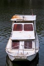 Old white river fishing boat parked at lake river / Motor Boat parked around bank of river Royalty Free Stock Photo