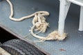 Old white rope tied to steel Royalty Free Stock Photo