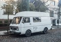 Old white rusty scrap German commercial panel delivery van VW LT 28 parked