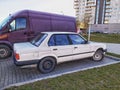 Old white sedan car BMW 316 model parked