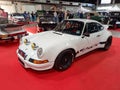 Old white sport 1973 Porsche 911 RSR Carrera speedster coupe on the red carpet. Classic car show