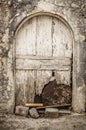 Old white timber door in the scuffed wall Royalty Free Stock Photo