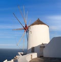 Old white traditional windmill in Oia village on Santorini Island, Cyclades, Greece Royalty Free Stock Photo