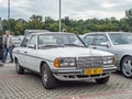 Old white veteran German car Mercedes Benz W123