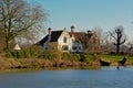 Old white villa along river Lys in Flanders, Belgium