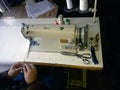 Old white vintage hand sewing machine. A man is sewing Royalty Free Stock Photo