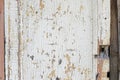 Old white wall texture with peeling background. Closeup. Old door