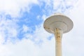 Old white water tank tower with clouds and blue sky background, clipping path Royalty Free Stock Photo