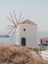 Old white windmill on the cliff in Santorini Royalty Free Stock Photo